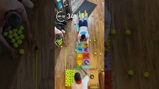 🔥🎾 81 TENNIS BALL CATCHES… WHILE HOLDING A PLANK?! 😱⚡ #guinnessworldrecords #mrworldrecords