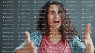 Portrait of angry young lady yelling gesturing fighting looking at camera