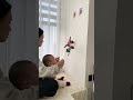 Dad bought the baby two little monkeys that can climb ropes. The baby played with them