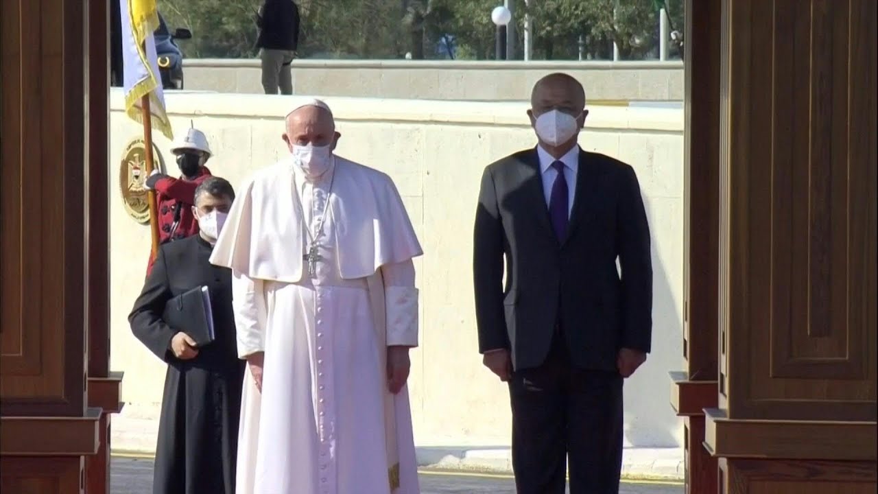 Pope Francis is welcomed by Iraqi President Barham Saleh at presidential palace | AFP