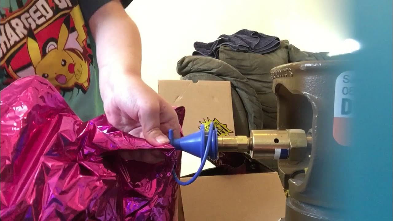 Inflating Mylar balloons it's a girl balloon and others a helium