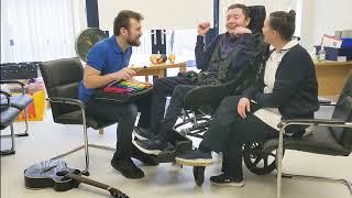 Josh using his Communication Aid in Music Therapy!