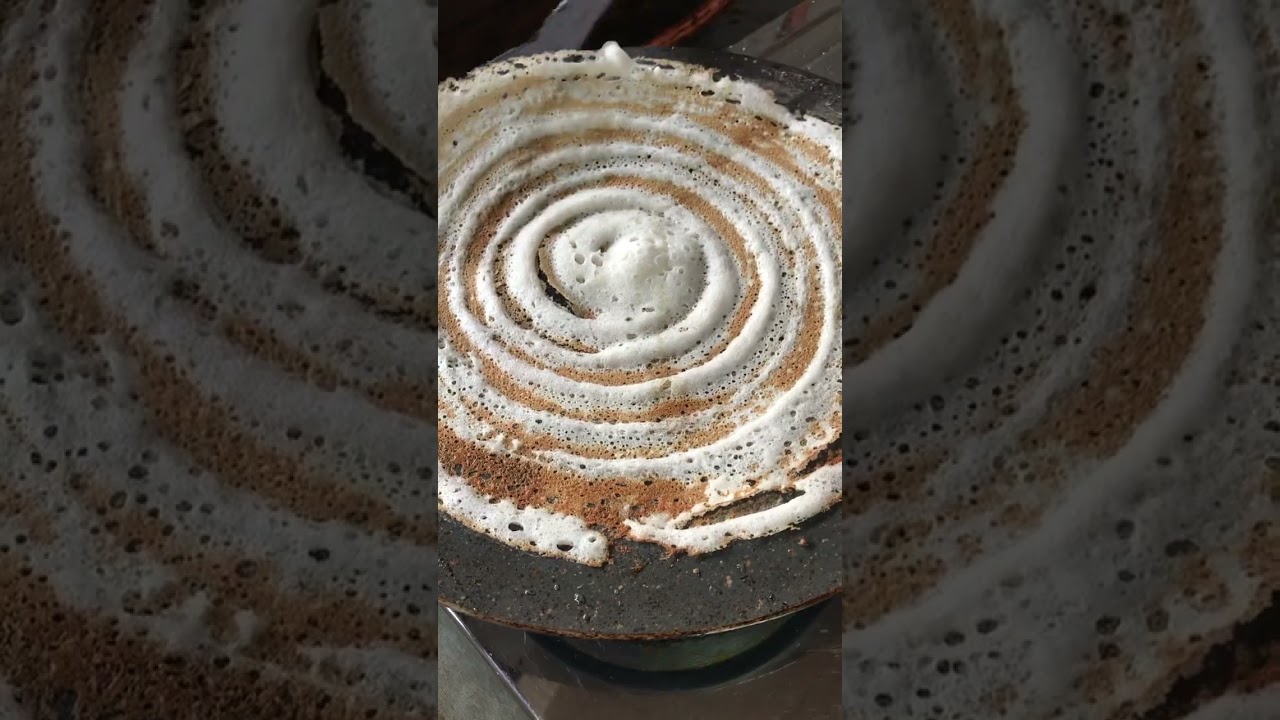 Dosa dipped in Sambar 