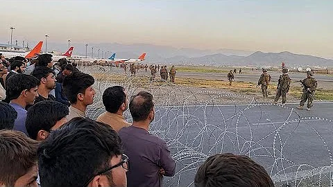 Afghans cling to departing US military plane as desperation grows at Kabul airport