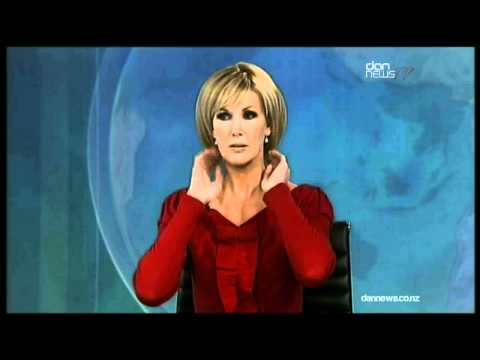 News Blooper: Newsreader caught doing her hair