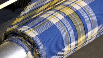 Scottish mill weaves yellow and blue tartan in Ukraine support | AFP