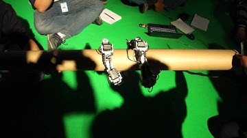 helix rolling thin pipe snake robot