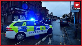 Men flee the scene after Land Rover crashes into parked cars