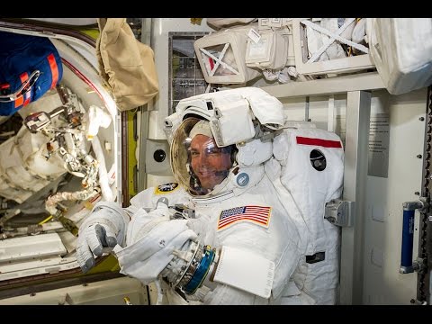 Astronauts take first walk outside International Space Station