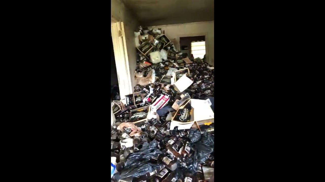 Extreme Hoarder Beer And Cigarettes Piled To The Ceiling