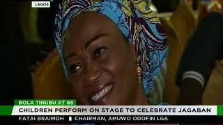 Students perform on stage to celebrate Tinubu @66