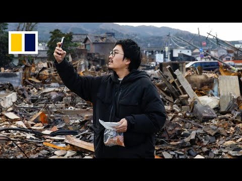 Cat lover searches for lost pets after Japan quake