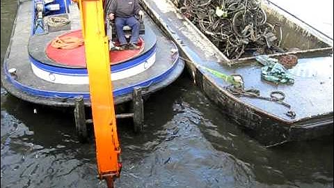 Cleaning old bikes out of the Amsterdam canals