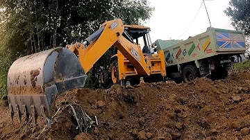 Village Area JCB Backhoe Loading Soil In Tripper Dump