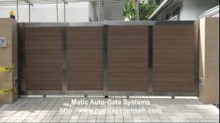 A very modern design and operation of gate utilizing stainless steel 304 frames and imported natural looking composite wood -that 