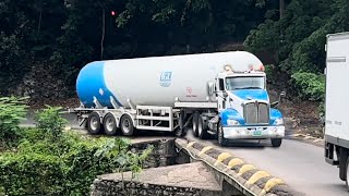 Wow, that was a close call! tractor-trailers & dump truck is crossing  flat bridge.