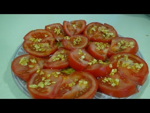Video: Mariscos Fritos Con Ajo Y Tomates
