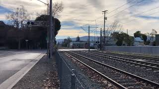 Northbound VTA Green Line Light Rail crosses Kennedy Avenue