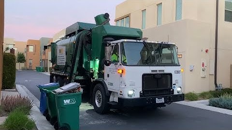 Waste Management Garbage trucks Working into the Night