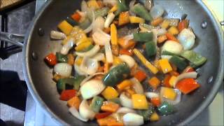 Cooking Smoked Sausage in Italian Dressing with Peppers and Onions