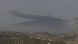 Large smoke plume climbs into sky over Gaza Strip