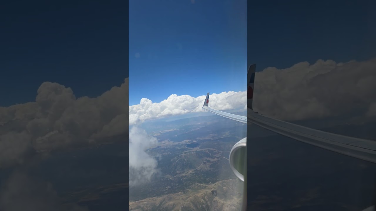 Climbing into the clouds out of RNO. Glimpse of Lake Tahoe in the background.