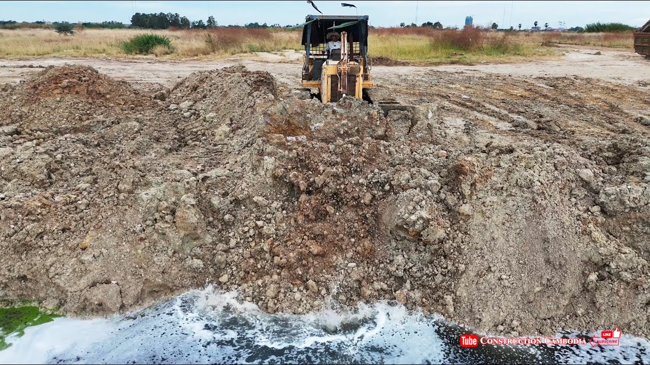 Road Expansion Projects By Komatsu Bulldozer Techniques For Road Building Pushing Soil Into Water