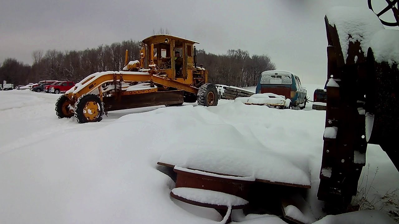 Plowing snow with a old grader YouTube