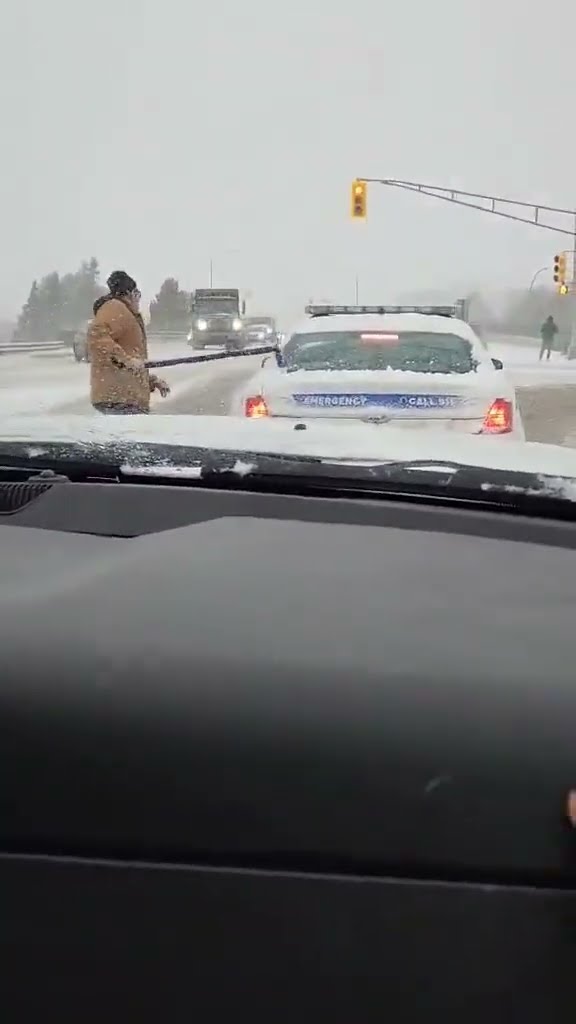 Man Clears Off Back Window Of Canadian Police Cruiser || ViralHog