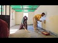 Rural family in Iran.  Babak paints the walls of the house with washable paint