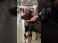 Young boy gets emotional hugging a muzzled Doberman at eventのサムネイル