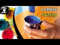 Painter painting design letters glare fonts sign board writing color mixing  key of arts