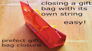 easy! closing a gift bag with its own string/ perfect gift bag closure/close gift bag with handles