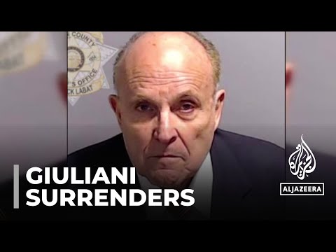 Trump lawyer and former mayor Rudy Giuliani surrenders to authorities