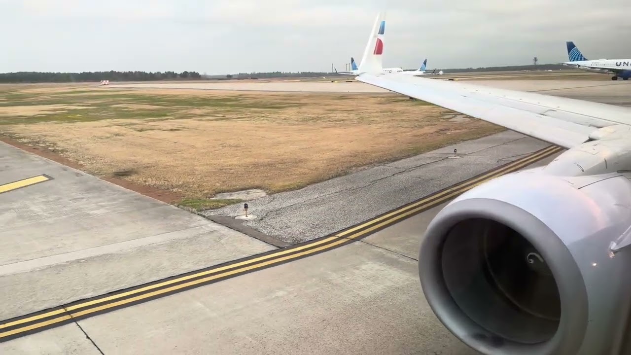 American Airlines 737-800W departing hazy Houston Bush (IAH) for Dallas Forth Worth (DFW)