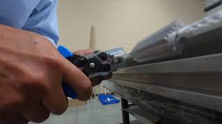 Putting Facid clips on PVC fabric edge - 100' example