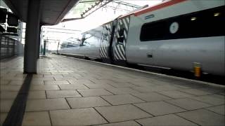 Virgin Pendolino Class 390 042 departs Manchester Piccadilly.