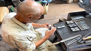 The process by which traditional Japanese hammers are made. 70yearold Japanese hammersmith.