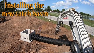 Installing The New Catch Basin In The Detention Pond