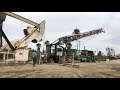 Oil well service co rigging up rig