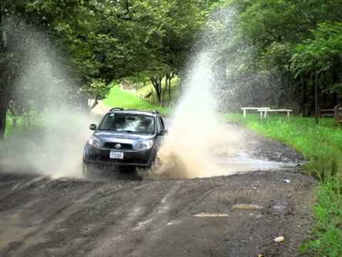 Rooster tail driving through a big puddle 