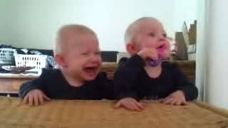 Twin baby girls fight over pacifier 2024