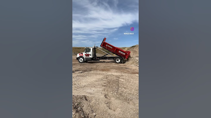 Lowboy Concrete Dumpsters at work - GrizzlyMaxx Dumpsters & Demolition. #dumpster #demolition