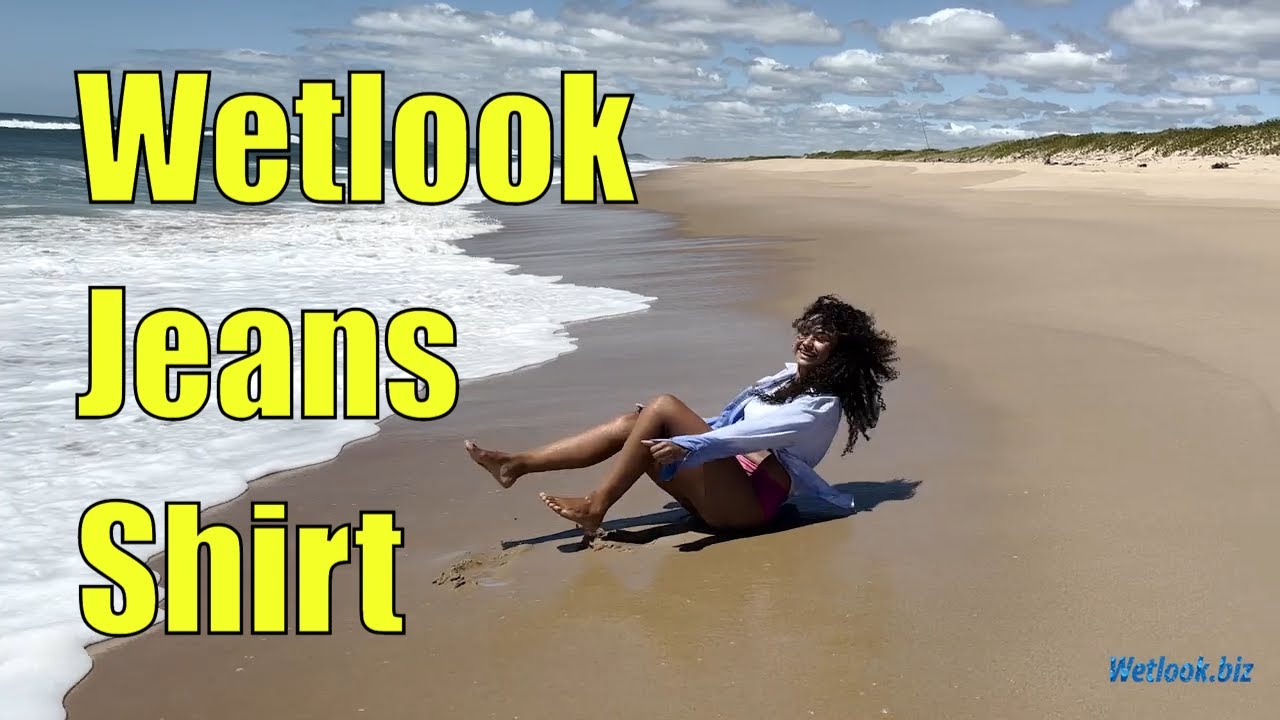 ⁣Wetlook girl getting wet in the ocean | Wetlook Jeans Shirt | Wetlook Curly-haired model