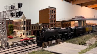 Union Pacific 844 leads excursion train over the Rock River railroad. Ho scale.