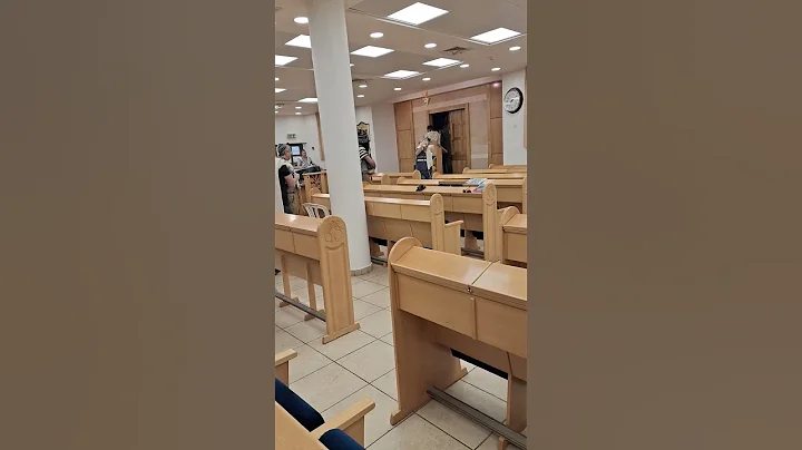 Returning the Torah scrolls to the Ark in a Synagogue in Israel during morning prayers