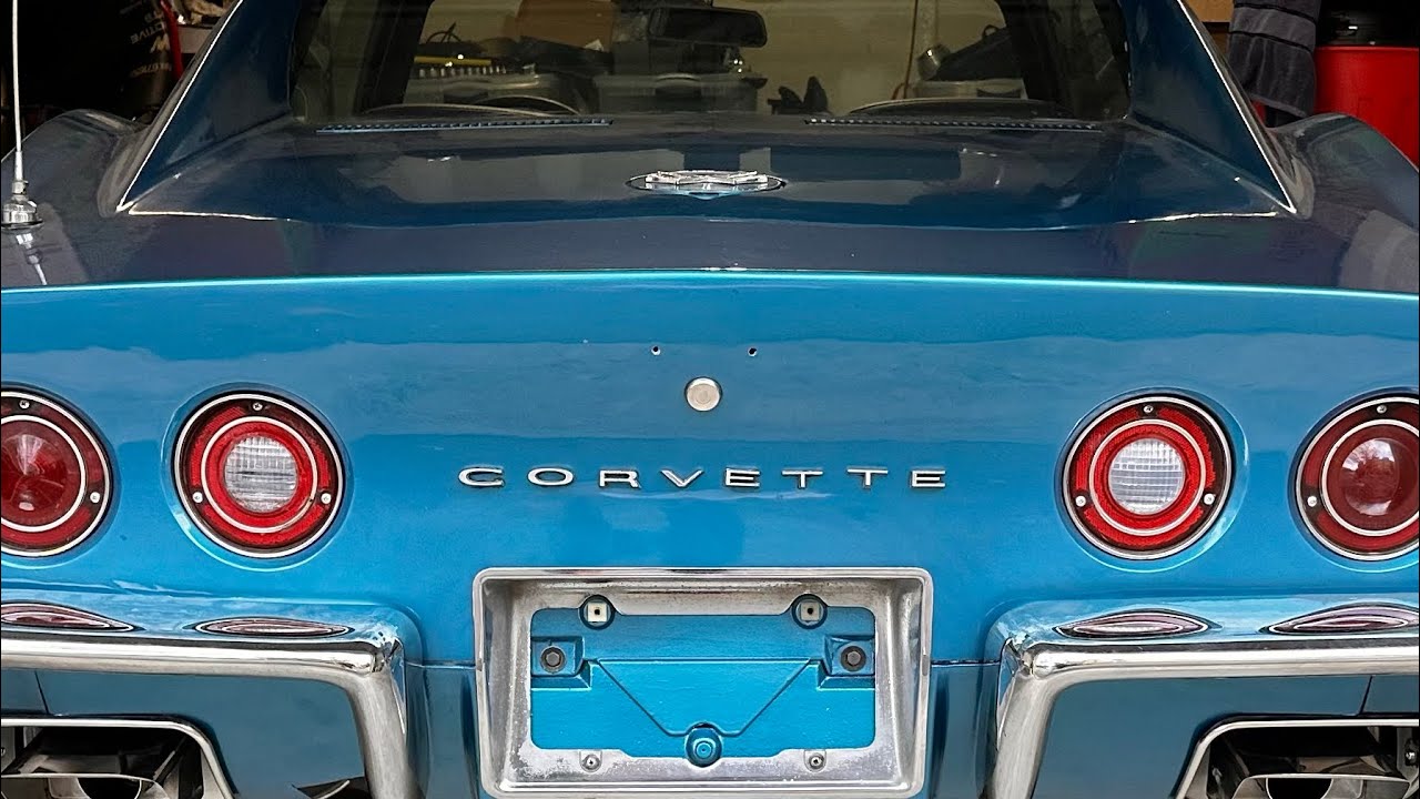 Used C3 Corvette Rear Taillight Panel Script – Single Letter 'V' Stingray Emblem 1968-1973