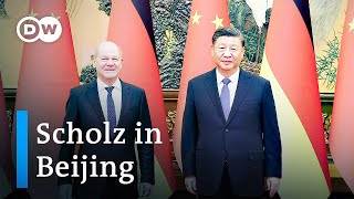German Chancellor Scholz draws fire over trade trip to China | DW News