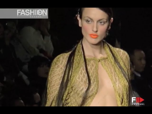 A model walks in the Louis Feraud Spring 1999 Couture Runway Show