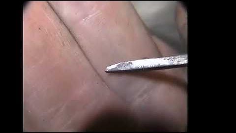Hand Engraving Re Sharpening a carbide graver by hand with 100 grit